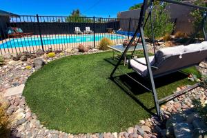 a hammock in a yard with a pool at 4 Mi to Beach Lake Havasu Apartment with Pool! in Lake Havasu City