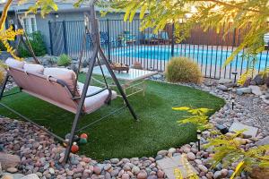 a swing in the middle of a yard at 4 Mi to Beach Lake Havasu Apartment with Pool! in Lake Havasu City