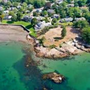 an aerial view of an island in the water at Swapscott Beachfront Vacation Home for Families in Phillips Point