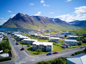 an aerial view of a town with mountains in the background at Apartment with Amazing Mountain View in Bolungarvík