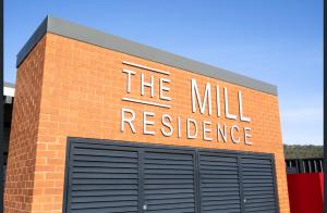 a brick building with the will resilience sign on it at Luxury 3 bdm Spacious apt in the heart of Wagga in Wagga Wagga