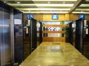 a hallway in a building with elevators and a long counter at TAGAYTAY PRIME RESIDENCES Big Group AMAZING HOMES unit2038-reach by viber in Tagaytay
