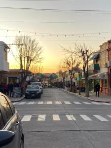 a city street with cars parked on the street at Departamento Diag Buenos Aires 55 in Capilla del Monte
