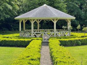 a gazebo in the middle of a garden at Hall Garth Hotel Darlington, Sure Hotel Collection by BW in Darlington