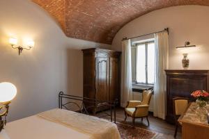 Łóżko lub łóżka w pokoju w obiekcie Hotel Mulino di Firenze - WorldHotels Crafted