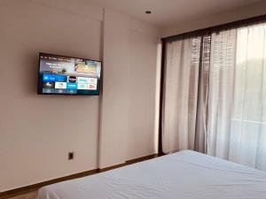 TV a/nebo společenská místnost v ubytování Hotel Muyu Tulum