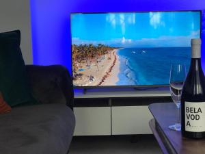 a television screen with a picture of a beach at Blue Sky in Skopje