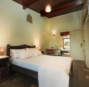 Säng eller sängar i ett rum på Barbanera Club & Hotel de Charme