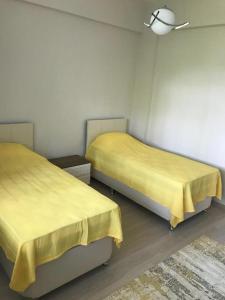 Postel nebo postele na pokoji v ubytování Hacısalihoğlu Apart