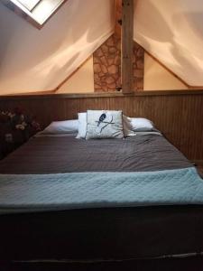 A bed or beds in a room at Our Private Wooded Cabin