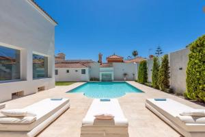 a swimming pool in the backyard of a house at Ohana2 Luxury Villa in Málaga