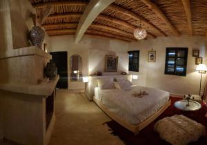 a bedroom with a bed and a sink in a room at ourika oufla in Ourika