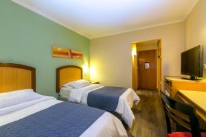 TV a/nebo společenská místnost v ubytování Hotel Exclusivo