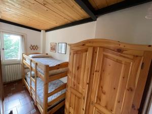 En eller flere senge i et værelse på La Grande Casa Di Montagna