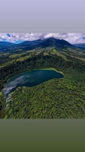 an aerial view of a lake in the middle of a field at Casa maar -Tented Camp in Río Cuarto