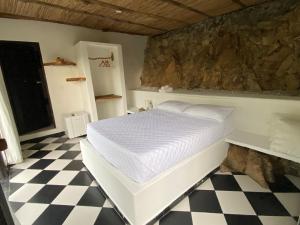 Postel nebo postele na pokoji v ubytování Akela Gaira Hotel