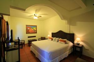 Ліжко або ліжка в номері Hotel Plaza Yat Balam