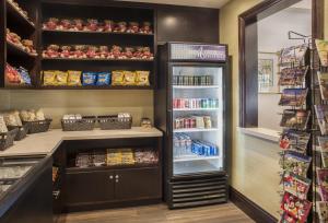 a grocery store with an open refrigerator at Ayres Hotel Orange in Anaheim