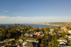 an aerial view of a town with palm trees and the ocean at Topaz By AvantStay Adorable Cottage Walking Distance to Beach w Large Patio in San Diego