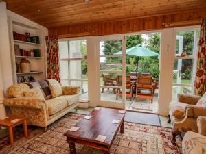 a living room with a couch and a table at The Laurels in Bishops Castle