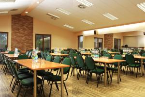 a conference room with tables and chairs in it at Sportpenzion Pohoda in Pilsen