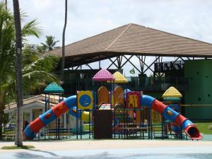 a playground with a slide in front of a building at Ancorar Flat Porto de Galinhas-Flat 3311-3314 in Porto De Galinhas