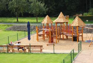 a park with a playground with a play equipment at Sportpenzion Pohoda in Pilsen