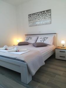 Postel nebo postele na pokoji v ubytování Apartment Villa Bijele Stijene