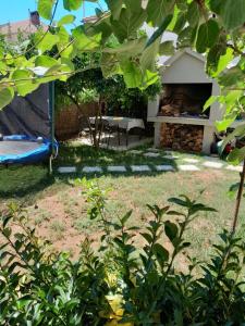 a backyard with a picnic table and a tent at MAJA GARDEN in Zadar