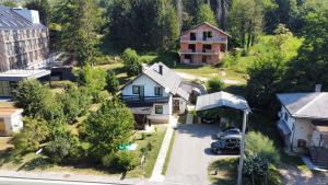 an aerial view of a house in a village at Rooms Bobic in Ličko Petrovo Selo