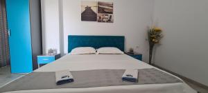 Giường trong phòng chung tại Mamaia Nord