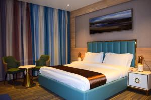 Ένα ή περισσότερα κρεβάτια σε δωμάτιο στο Taij resort hotel +40 φωτογραφίες