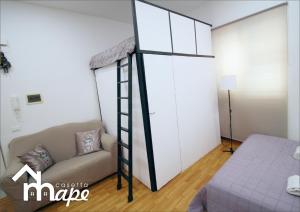 A bed or beds in a room at La casetta mape