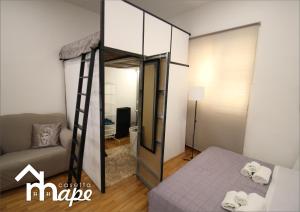 A bed or beds in a room at La casetta mape