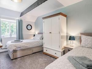 Llit o llits en una habitació de Granary Cottage