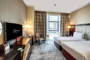 TV a/nebo společenská místnost v ubytování Copthorne Hotel Dubai