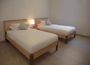 Postel nebo postele na pokoji v ubytování Rafa Homes - Al Falah