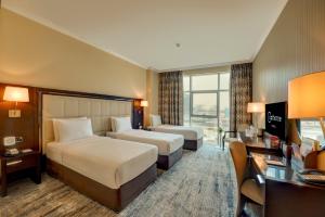 Postel nebo postele na pokoji v ubytování Copthorne Hotel Dubai