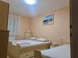 Postel nebo postele na pokoji v ubytování Sunshine apartment 3