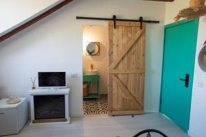 a sliding barn door in a living room with a fireplace at SpeedHouse in Alba Iulia