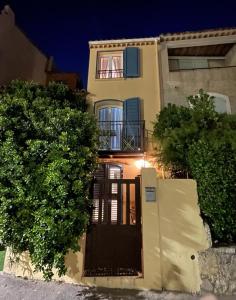 a house with a gate in front of it at La Maisonette Antibes in Antibes