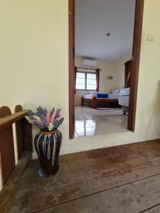 Postel nebo postele na pokoji v ubytování Phangan Villa Bungalows
