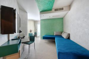 Телевизор и/или развлекательный центр в Carrick Hotel Camogli Portofino Coast