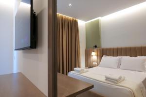 Postel nebo postele na pokoji v ubytování NERIUM Hotel