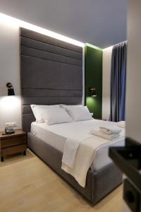 Postel nebo postele na pokoji v ubytování NERIUM Hotel