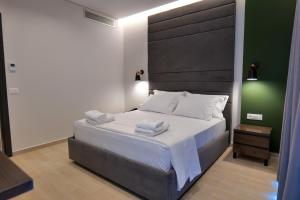 Postel nebo postele na pokoji v ubytování NERIUM Hotel