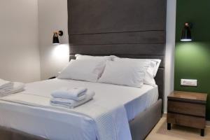 Postel nebo postele na pokoji v ubytování NERIUM Hotel