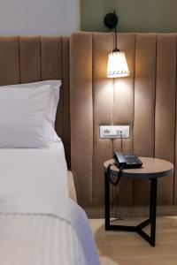 Postel nebo postele na pokoji v ubytování NERIUM Hotel