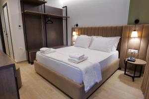 Postel nebo postele na pokoji v ubytování NERIUM Hotel