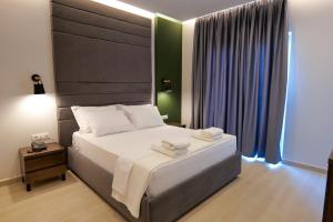 Postel nebo postele na pokoji v ubytování NERIUM Hotel